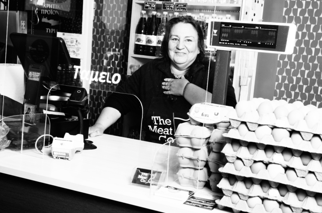Panagiota at the cash register